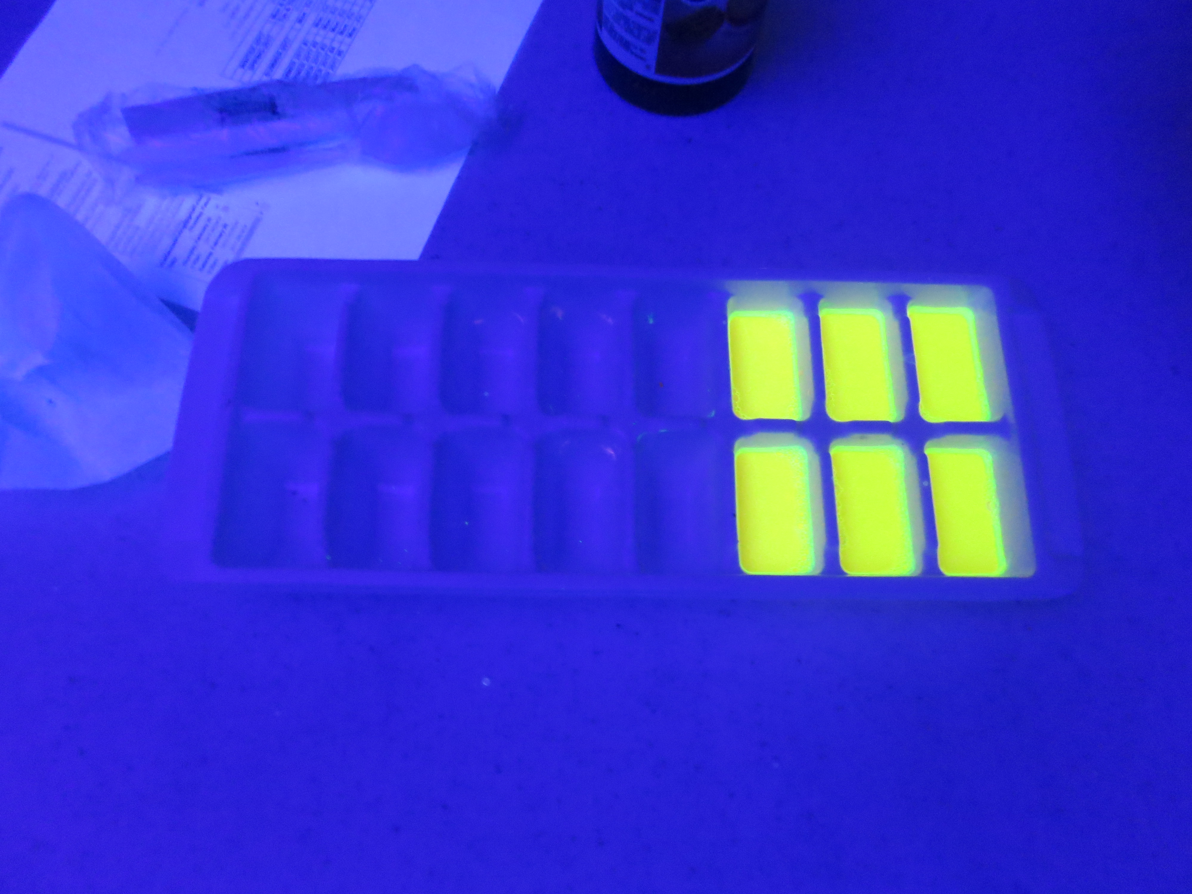 picture of chalk poured into mold during black light workshop with Carlos Gacharna