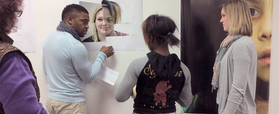 participants and artists looking at art