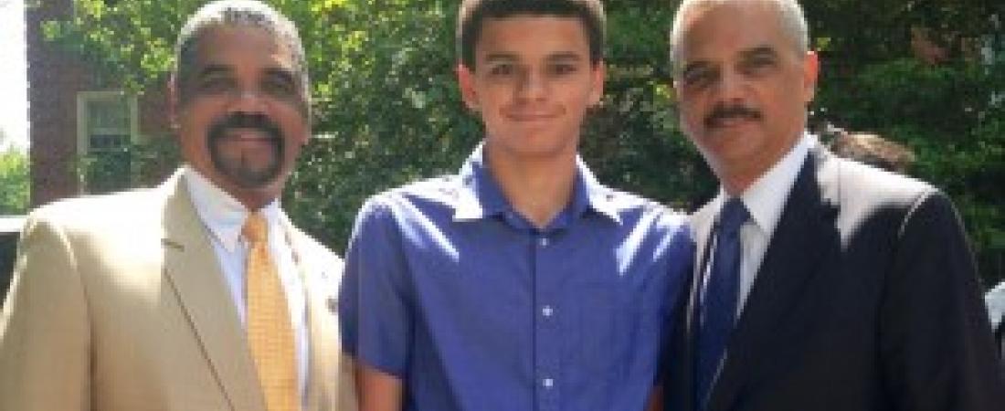 Attorney General Holder attends an event with his son, Eric Holder III, and his brother, William Holder. (Credit: Department of Justice)