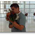 Picture of teen hugging a bouquet of flowers